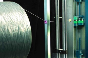 KARL MAYER-Crêpe pretensioner for high twisted yarn  Warping drum rotation